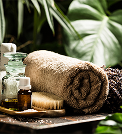 Spa and massage products with orchids on a old wooden background